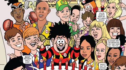 A colourful comic‑style birthday scene features a large decorated cake with “Happy 10th Dennis” written on it and Dennis The Menace in the middle in his trademark red and black striped jumper.
Animated characters surround the cake in a festive outdoor setting with bright banners and balloons.
The cover is filled with lively illustrations, speech bubbles, and bold text celebrating a 10th‑birthday theme.
