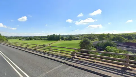 Google Farmland visible from the A370 Long Ashton bypass, looking south. It is a clear, sunny day with blue sky