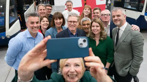 PA Media Mayor of West Yorkshire Tracy Brabin takes a selfie at a meeting with Labour's newly expanded team of mayors