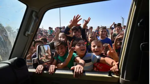 Reuters Iraqi boys gather on the road as they welcome Iraqi security forces members, who continue to advance in military vehicles in Kirkuk, Iraq October 16, 2017.