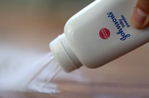 A container of Johnson & Johnson baby powder is poured