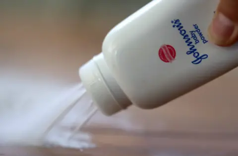 Getty Images A container of Johnson & Johnson baby powder is poured