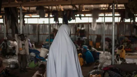 Getty Images A women in a camp for internally displaced persons in Nigeria