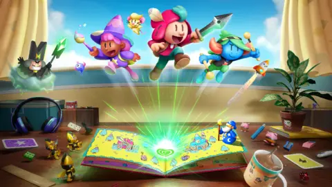 A computer-generated image shows three cartoon characters - a witch, blue-skinned troll and a central, sword-wielding hero in a pink tunic - jumping out of the pages of a story book in a shower of green magical sparks. The book is set on a desk, with a houseplant, headphones, and various bits of stationery scattered around it, facing a window. Three tiny soldiers stand next to the book, and a miniature beared wizard in blue robes stands on an open page.