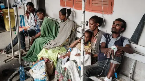 AFP People who were injured in their town Togoga in a deadly airstrike on a market, wait on a bench for medical treatments at Mekelle General Hospital in Mekele, on June 24, 2021, two days after a deadly airstrike on a market in Ethiopia's war-torn northern Tigray region,