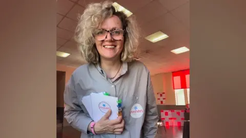 Susie Pinner woman holding Pinners kit