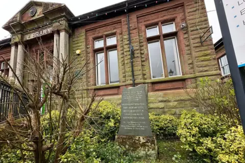 BBC A memorial stone outside a library