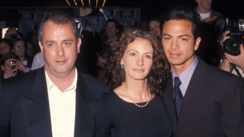 Getty Images Director Roger Michell, actress Julia Roberts and actor Benjamin Bratt at the Notting Hill New York City Premiere in 1999