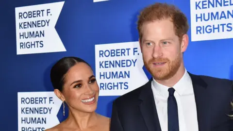 Getty Images Prince Harry, Duke of Sussex, and Meghan, Duchess of Sussex, arrive at the 2022 Robert F. Kennedy Human Rights Ripple of Hope Award Gala