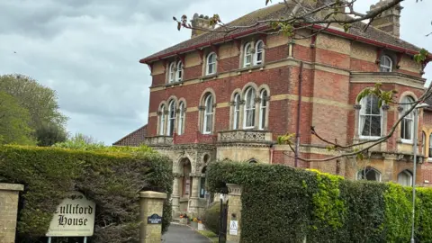 The entrance to Culliford House, Dorchester. A large brick building dating from the 1860s.