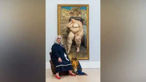 Sotheby's A woman sits next to a portrait. 