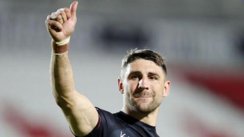Tommy Makinson of St.Helens acknowledges the fans following the Betfred Super League match between St Helens and Catalans Dragons at Totally Wicked Stadium on May 31, 2024 in St Helens, England