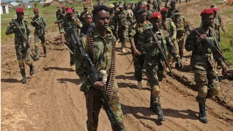 Getty Images Somali soldiers march at a military base 450 km south of the capital Mogadishu