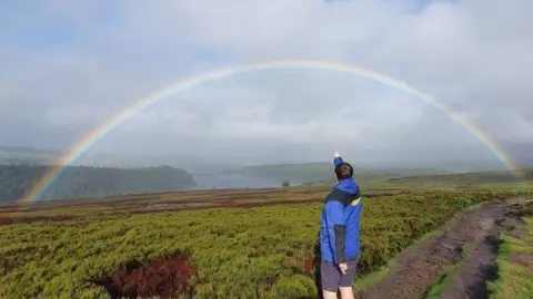 Craig Haimes Craig Haimes pointing to the rainbow