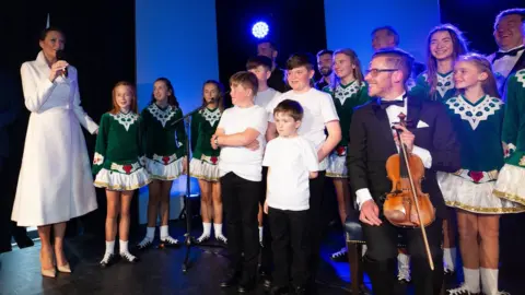 Getty Images Melania Trump spoke to performers and musicians during her visit to County Clare