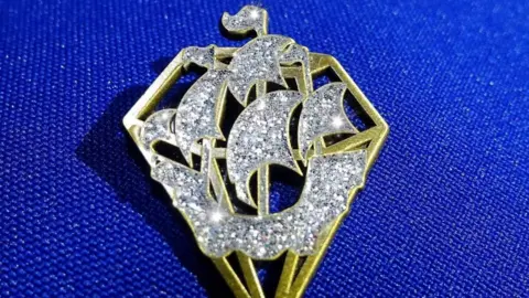 the diamond badge