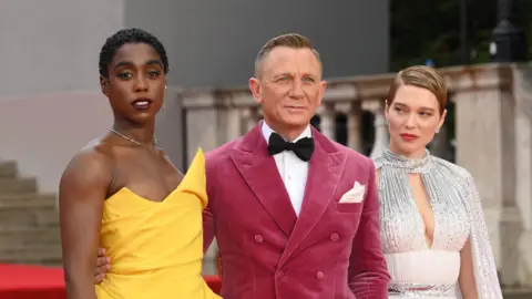 Getty Images Lashana Lynch, Daniel Craig and Lea Seydoux attend the No Time To Die premiere at the London's Royal Albert Hall in 2021