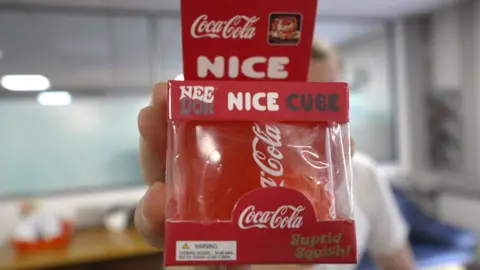 A fake coca-cola "Nee-doh" cube.