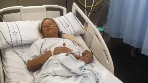 Julie Hankey Lavelle Crutchley in hospital bed