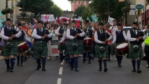 Bagpipers lead the GAA World Tour parade