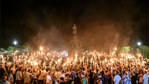 Reuters Photo of white nationalist protesters with tiki torches protesting on university campus