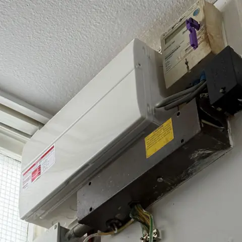 Nathan Rollinson Image showing fuse box and key-operated meter fitted under the ceiling in Mr Rollinson's flat