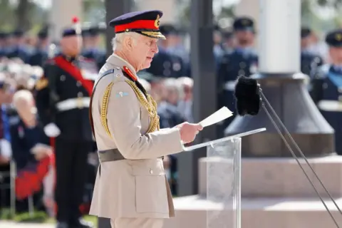 LUDOVIC MARIN/AFP King Charles III speaking during the UK national commemorative event for the 80th anniversary of D-Day, held at the British Normandy Memorial in Ver-sur-Mer, Normandy, France.  June 6, 2024.