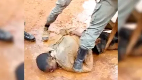 This video appears to show Cameroonian gendarmes torturing a separatist commander