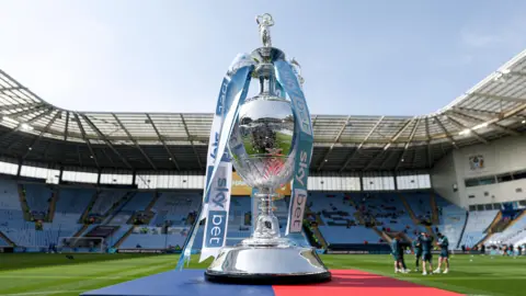 The Championship trophy on a stand with sky blue and white ribbons at Coventry City's home stadium before their game with Wrexham in April.