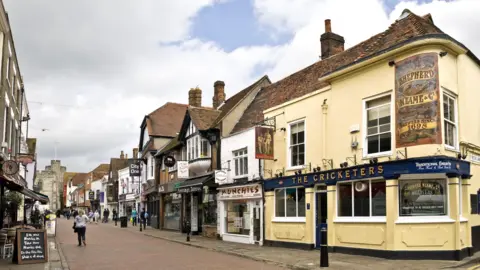 A generic picture of a street lined with old buildings in Canterbury City Centre.