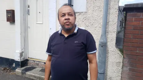 Abdul Raab stands outside a mosque in Newtownards