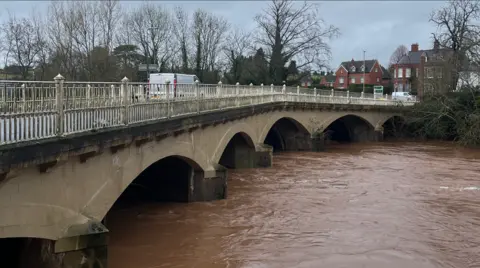 A bridge in Tenbury Wells with high water levels running underneath