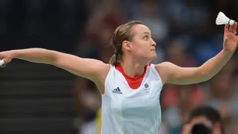 Adek Berry/AFP/Getty Images Susan Egelstaff holding a shuttlecock and preparing to swing her racket at the London Olympic Games in 2012