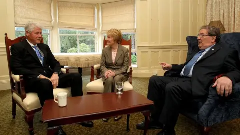 Getty Images Bill Clinton, Pat and John Hume