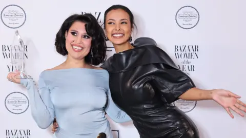 Getty Images Raye and Maya Jama at the Harper Bazaar Women of the Year award 