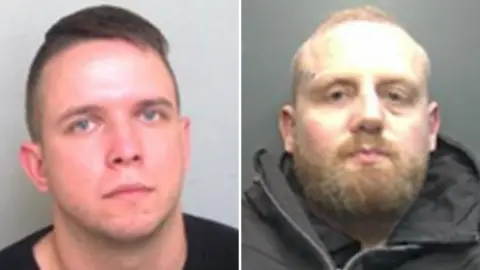 A police custody image of Aurimas Sarkis and Ignas Kisskiss, put together. Sarkis, has short dark hair and is wearing a black top, KissKiss has a tattoo on his face, a beard, short hair and is wearing a black coat. They are both looking straight at the camera.