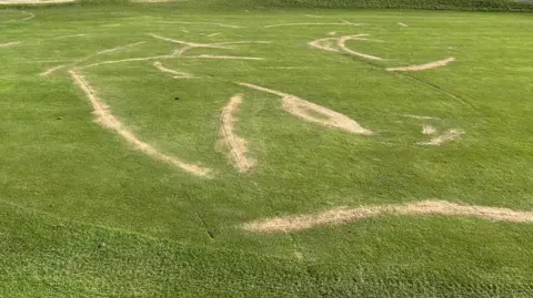 Supplied Scars on a golf course in West Yorkshire are repaired with sand