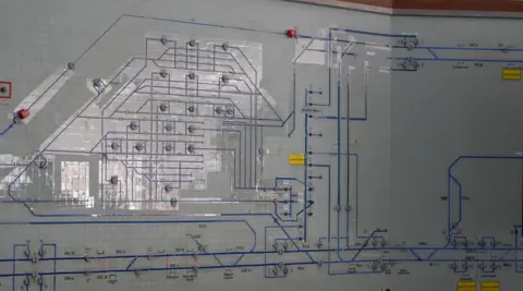 BBC/Jim Scott The original display which is now being decommissioned. It has a series of grids with blue lines that indicate where the tracks and junctions are located. It has since been switched off.