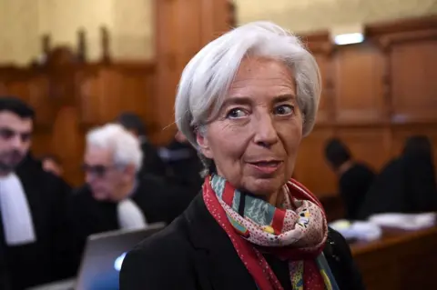 AFP International Monetary Fund chief Christine Lagarde, right, arrives at the special Paris court, France, 12 December