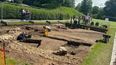 An archaeological dig taking part to uncover remains of a Norman Castle in Chichester's Priory Park

