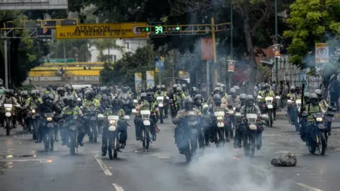 AFP Riot police try to prevent anti-government demonstrators from gathering in Caracas on June 29, 2017