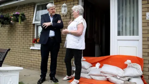 DfI John O'Dowd with Gretta Mooney