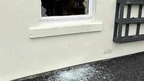 Chris Simpson Smashed pub window