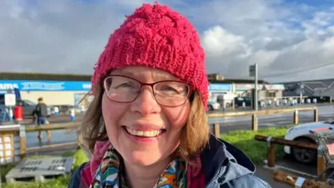 ANDREW TURNER/BBC Farmer Emma Tacon outside Lathams Discount Store in Potter Heigham