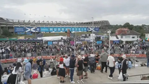 Large queues of Oasis fans outside Murrayfield Stadium in Edinburgh.