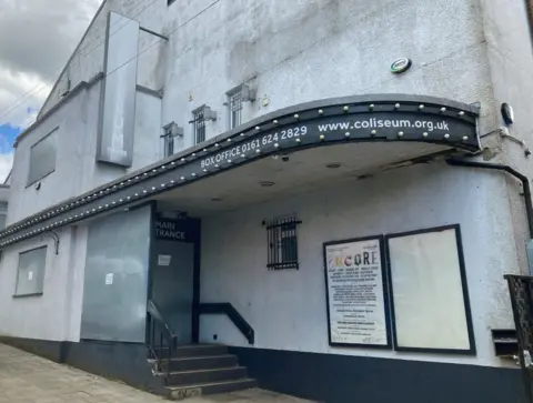 Exterior of Oldham Coliseum theatre, with discoloured ageing paint