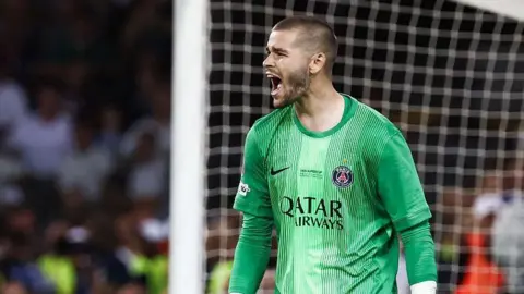Lucas Chevalier celebrating in the Super Cup for PSG