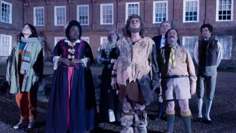 The cast of Ghosts outside West Horsley Place in Surrey