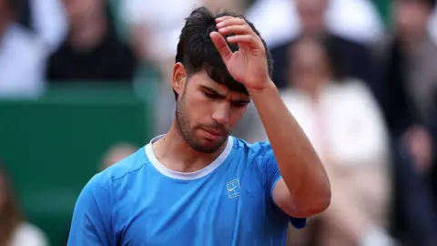 Carlos Alcaraz looking glum faced during the Monte Carlo Masters