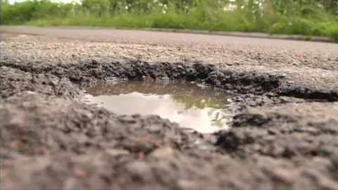 A pothole on a country road.